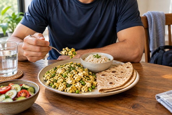 A person eating cooked egg-white bhurji with roti and rice after exercise